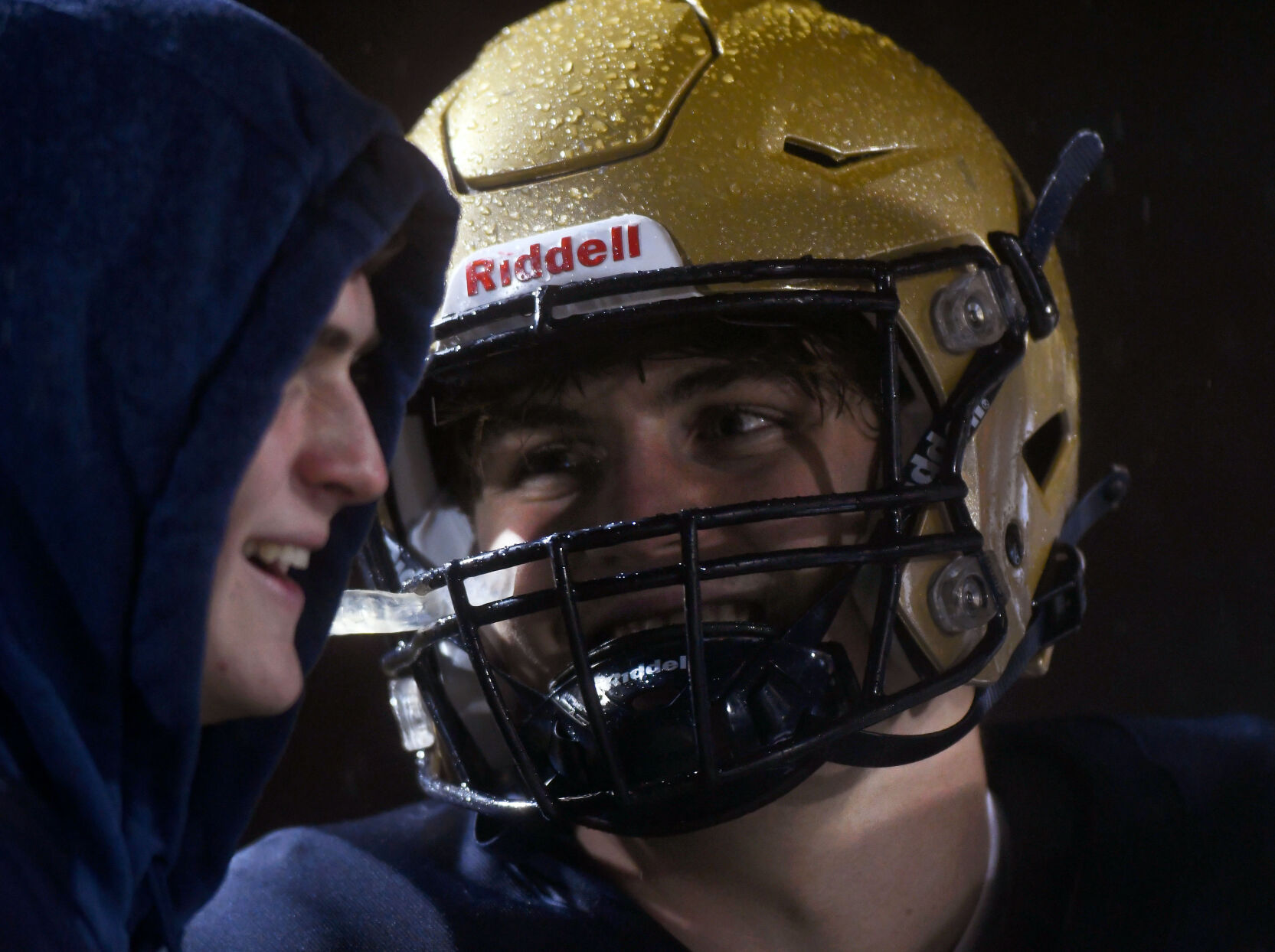 Helias players Lucas Bloomer and Harrison Miller talk on the sidelines of the game